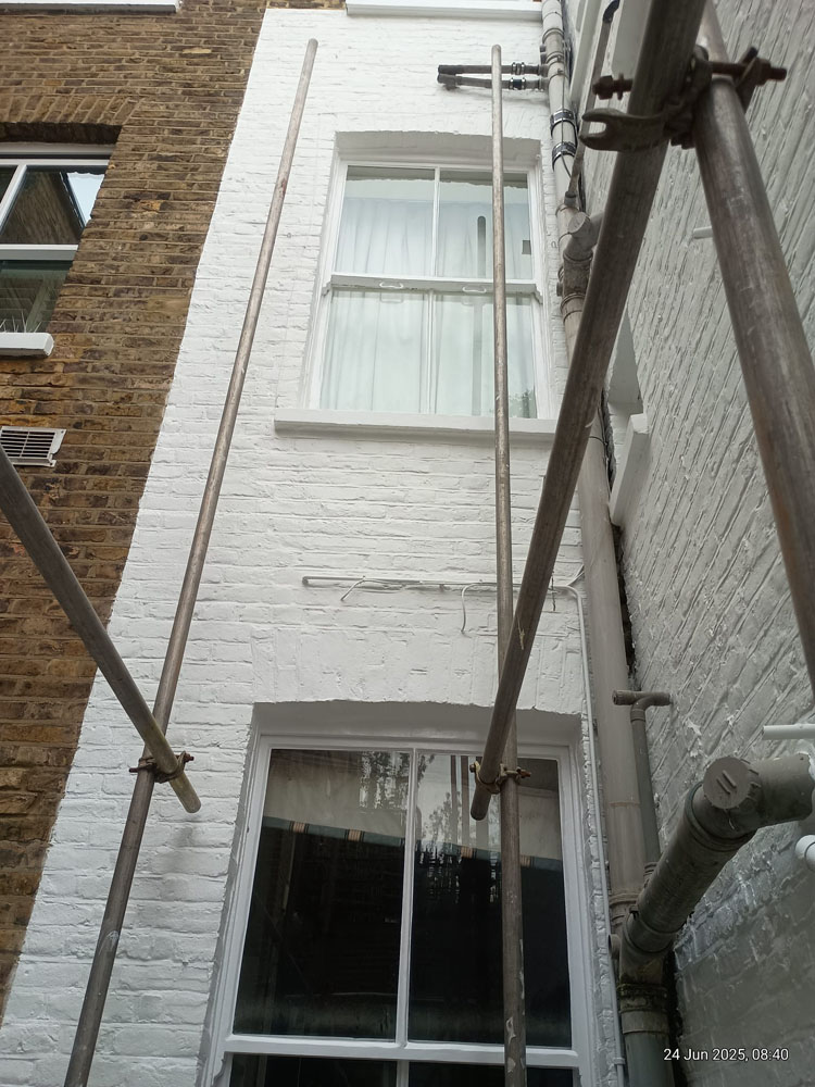 Finished rear view four story elevation – Chelsea renovation by WLP